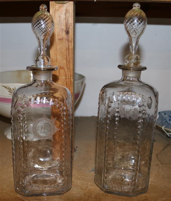 A pair of etched glass decanters